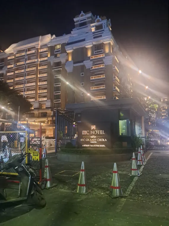 A multi-storey building and event entrance at night.